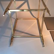 Gilded brass and smoked glass end table, 1960s.