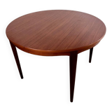 Round teak table with Scandinavian design extensions from the 60s vintage