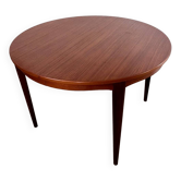 Round teak table with Scandinavian design extensions from the 60s vintage