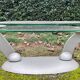 Design coffee table Naos in tempered glass and cast iron.