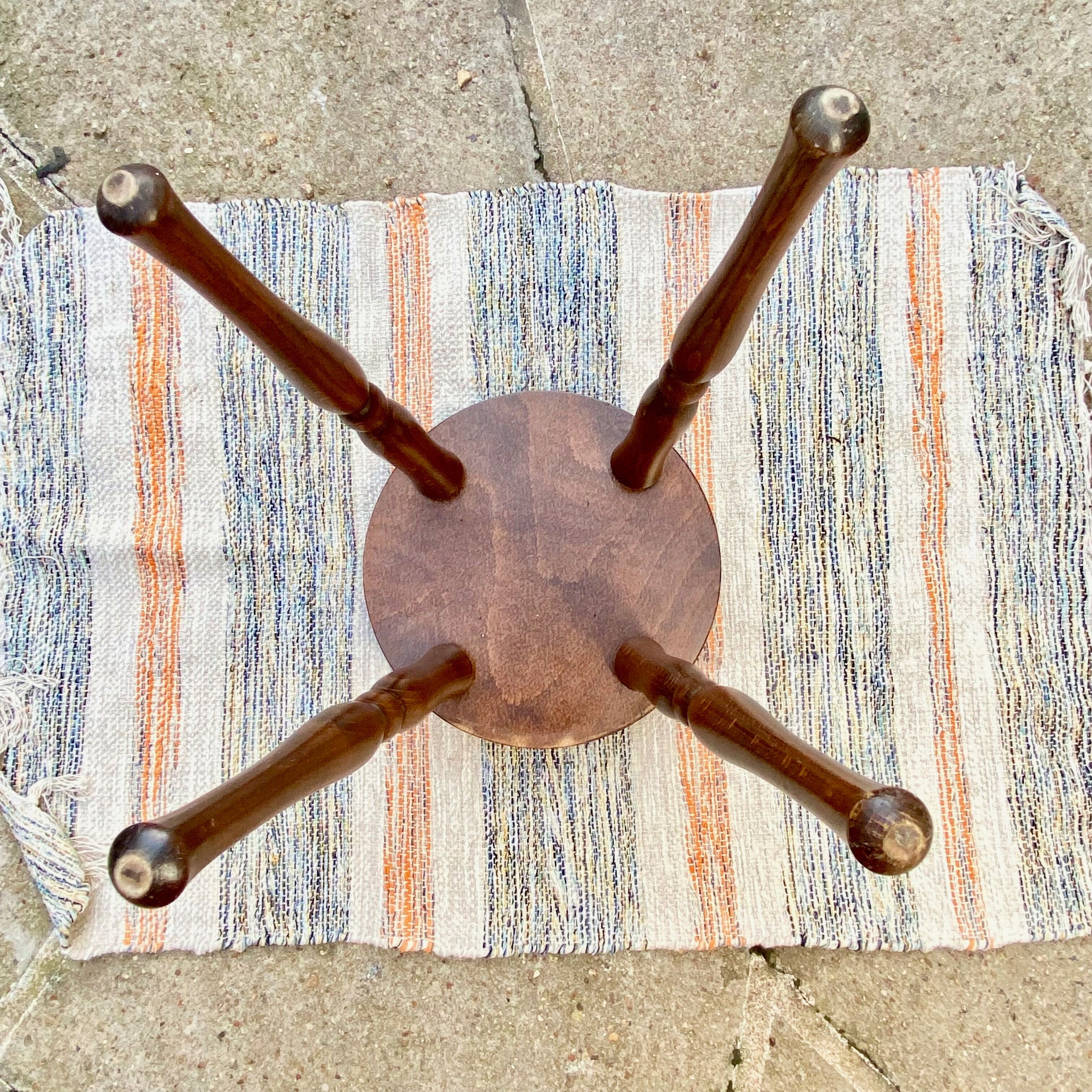 Vintage stool with turned wooden legs