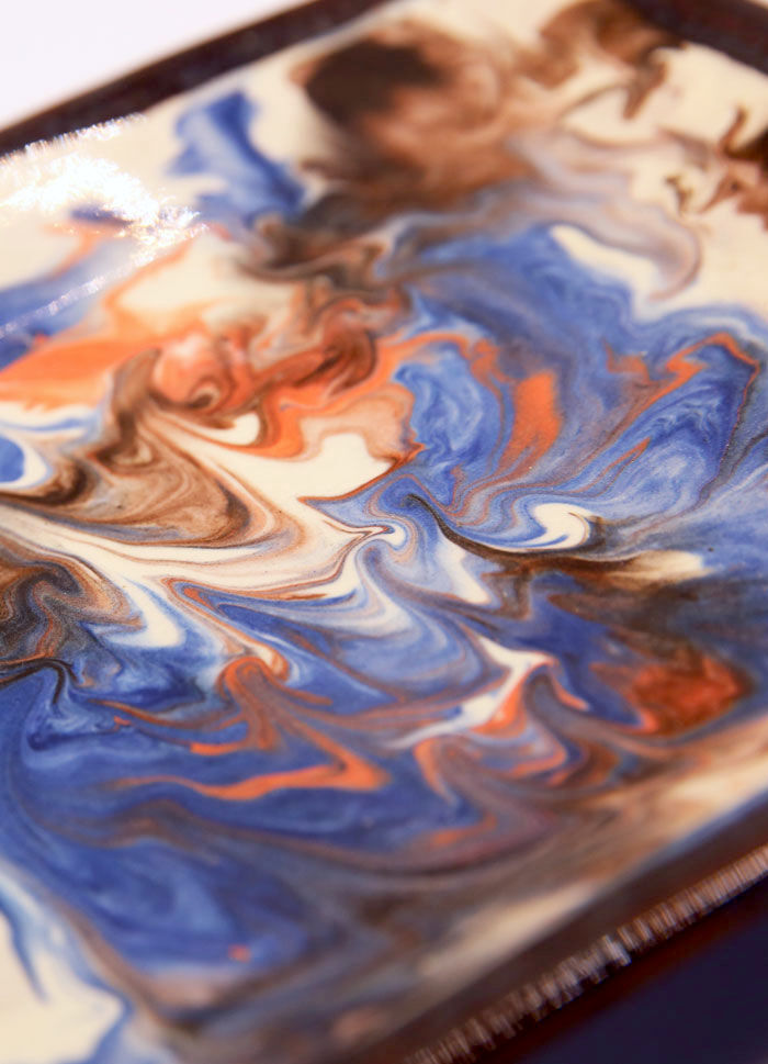Square plate in enamelled earth with multicolored mottling