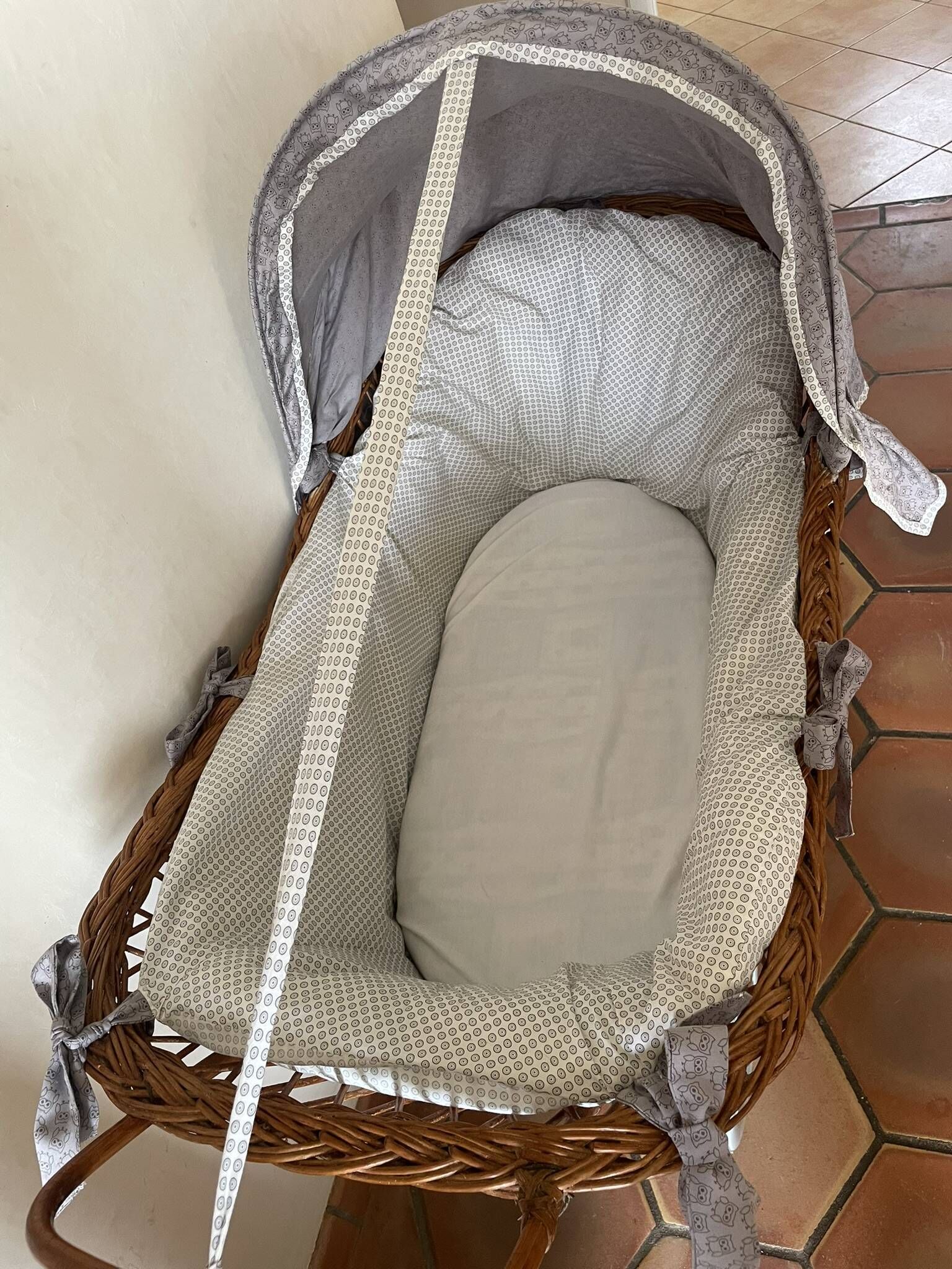Antique rattan cradle in very good condition. Sold with or without upholstery.