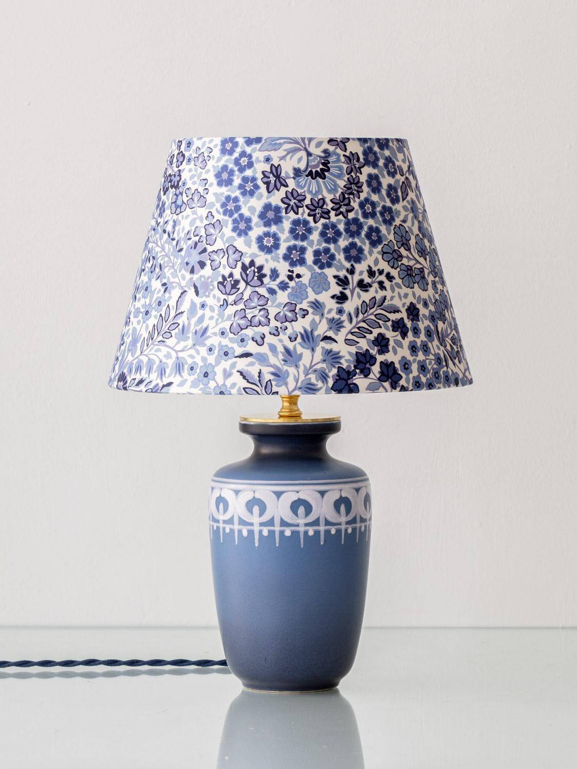 Mid-century modern blue ceramic table lamp with new Liberty London floral shade.