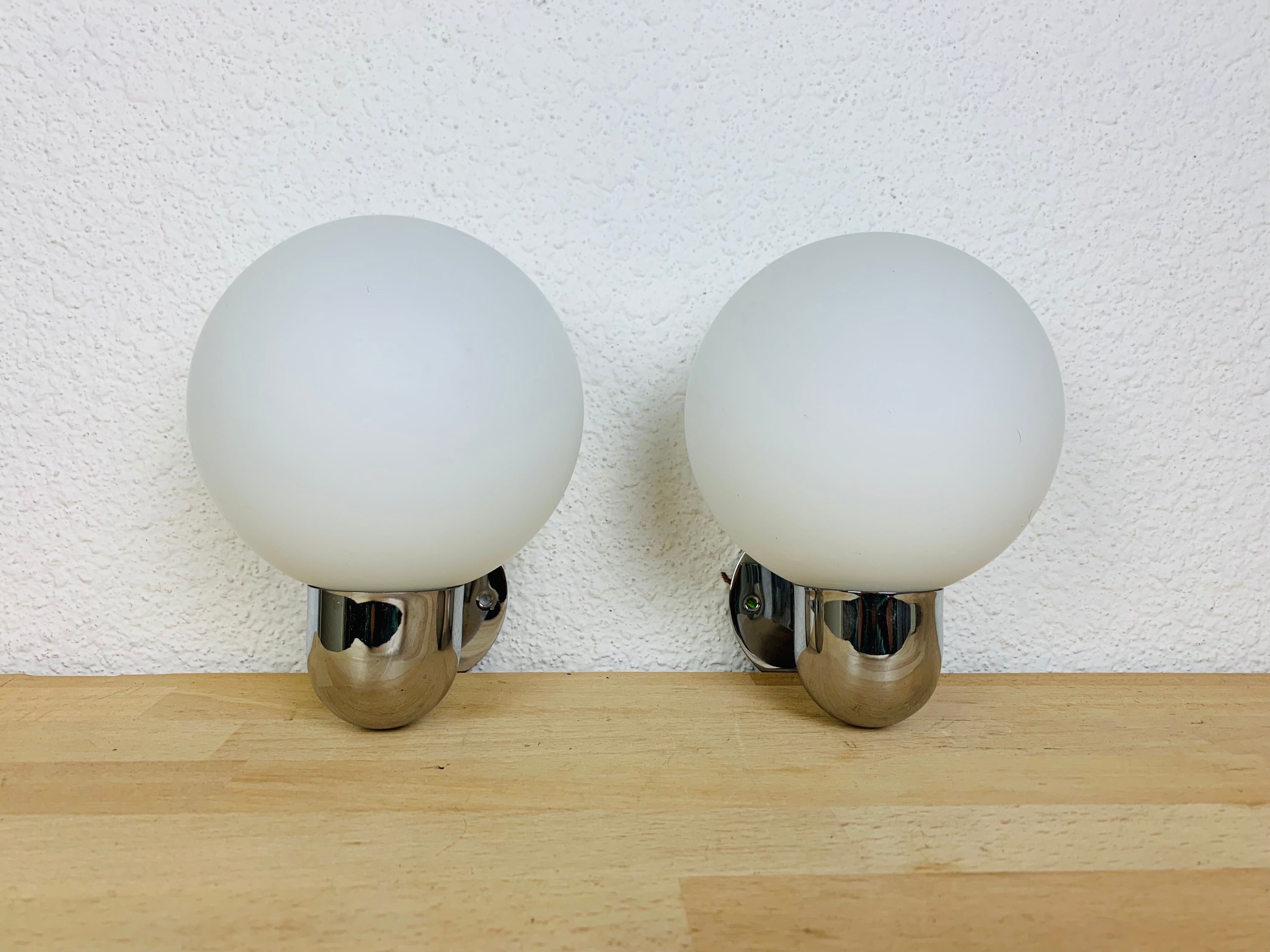 Pair of wall lamps space age chrome and opal globe 70s
