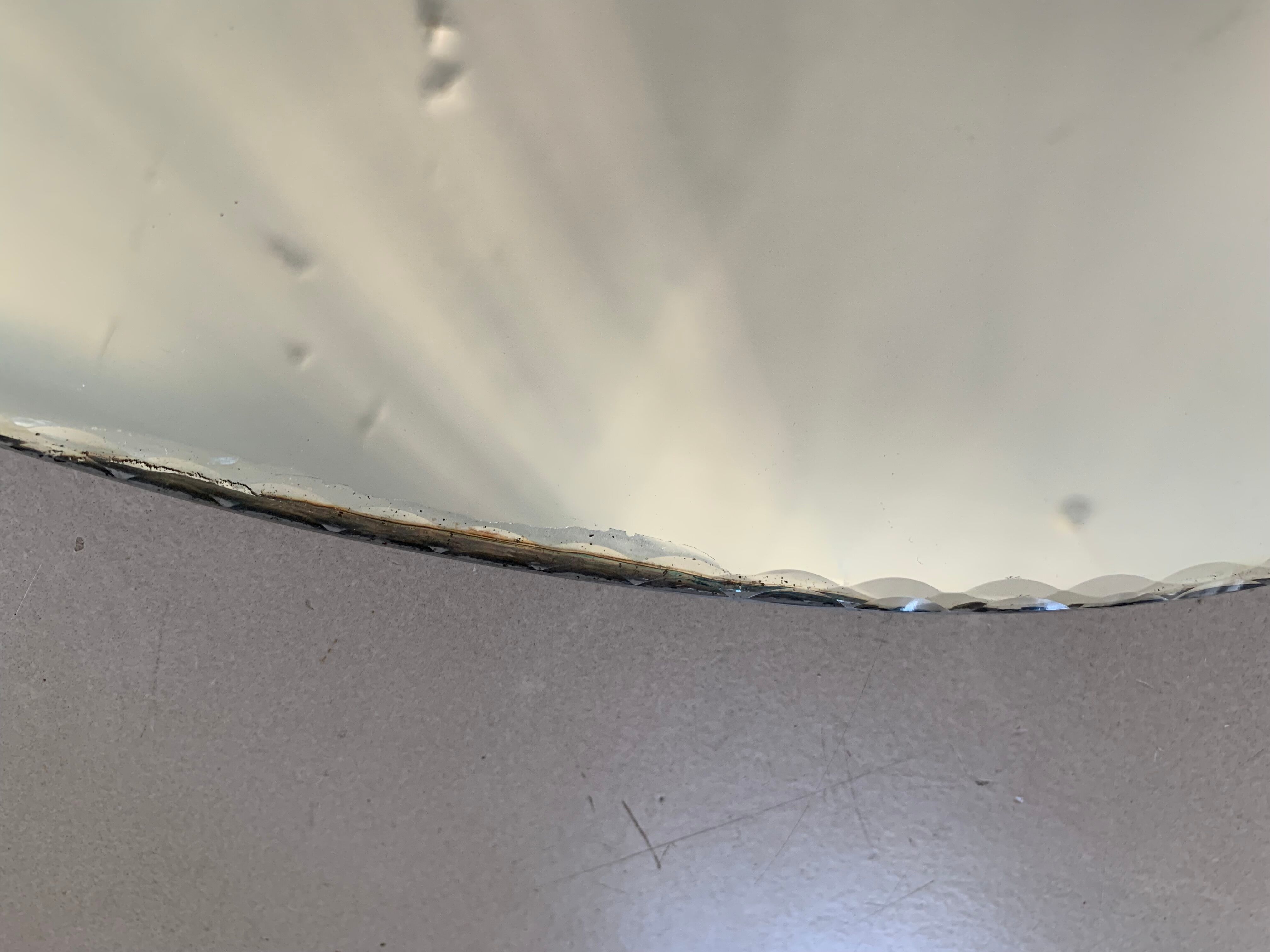 Old beveled oval mirror