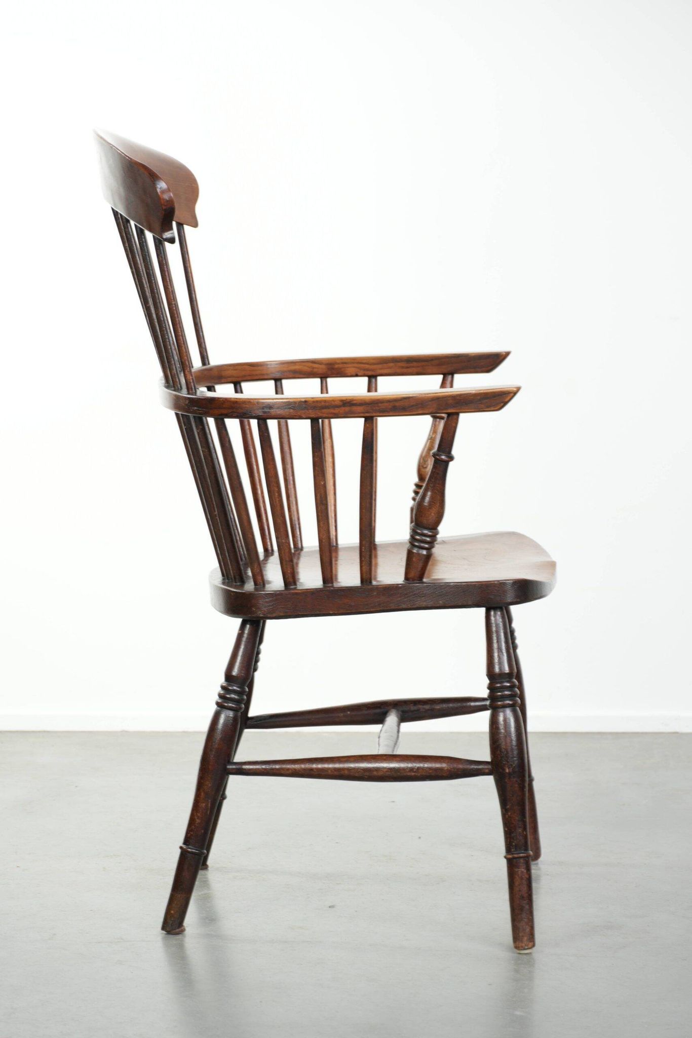 Antique English Windsor highback chair from the 19th century