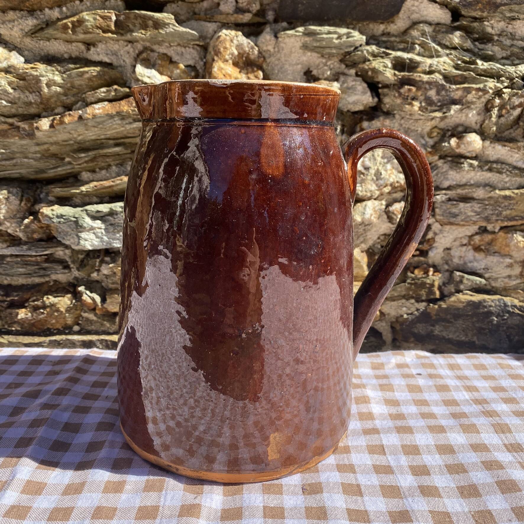 Old glazed terracotta pitcher