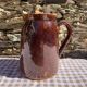 Old glazed terracotta pitcher