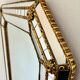 Vintage Spanish Venetian-style wall mirror, octagonal brass, 1980s Hollywood Regency