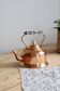 Vintage kettle in copper and ceramic