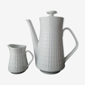 White porcelain coffee maker and milk pot