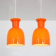 Pair of orange hanging lamps by Raak, the Netherlands, 1970