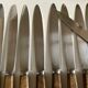 Set de 12 couteaux manches en bois d'olivier 1960