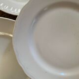 5 mismatched old white plates.