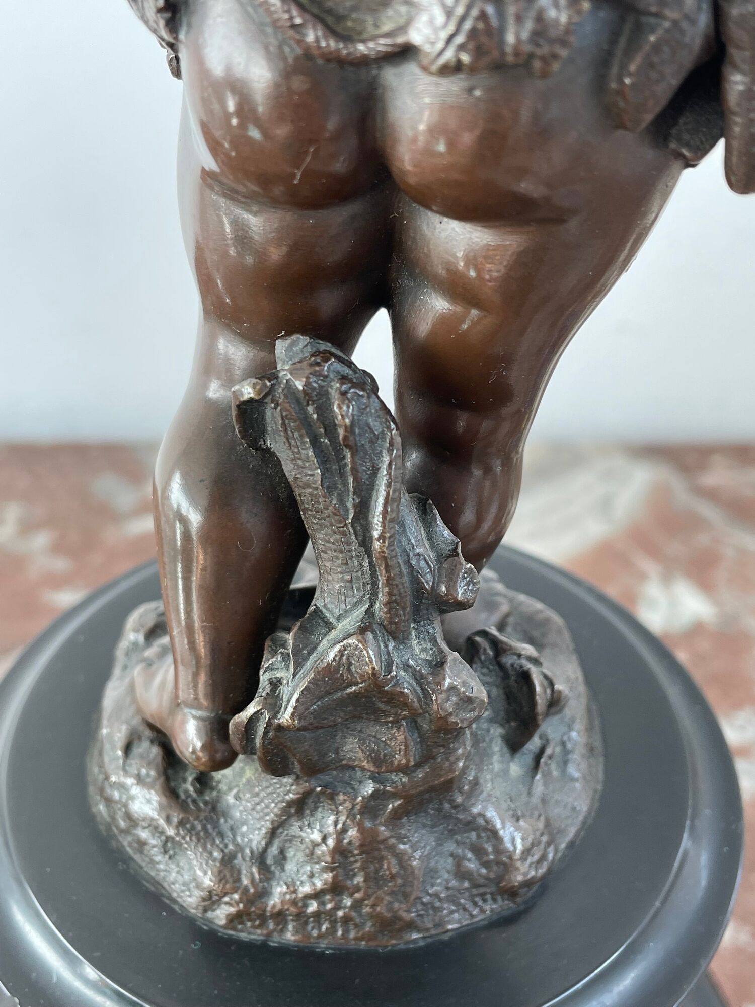 Candelabra with cherub in patinated bronze