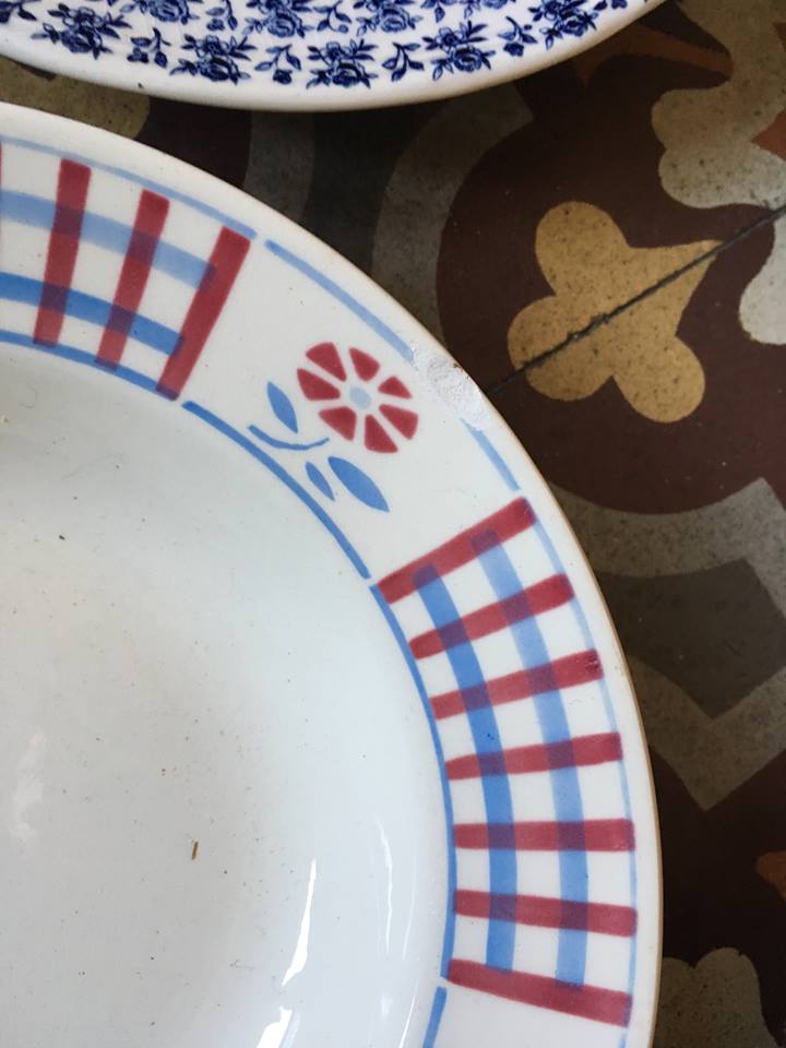 Six soup plates don't match in red and blue.