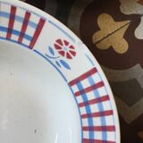 Six soup plates don't match in red and blue.