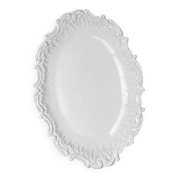 Antique deep dish in white Limoges porcelain, with rockwork relief.