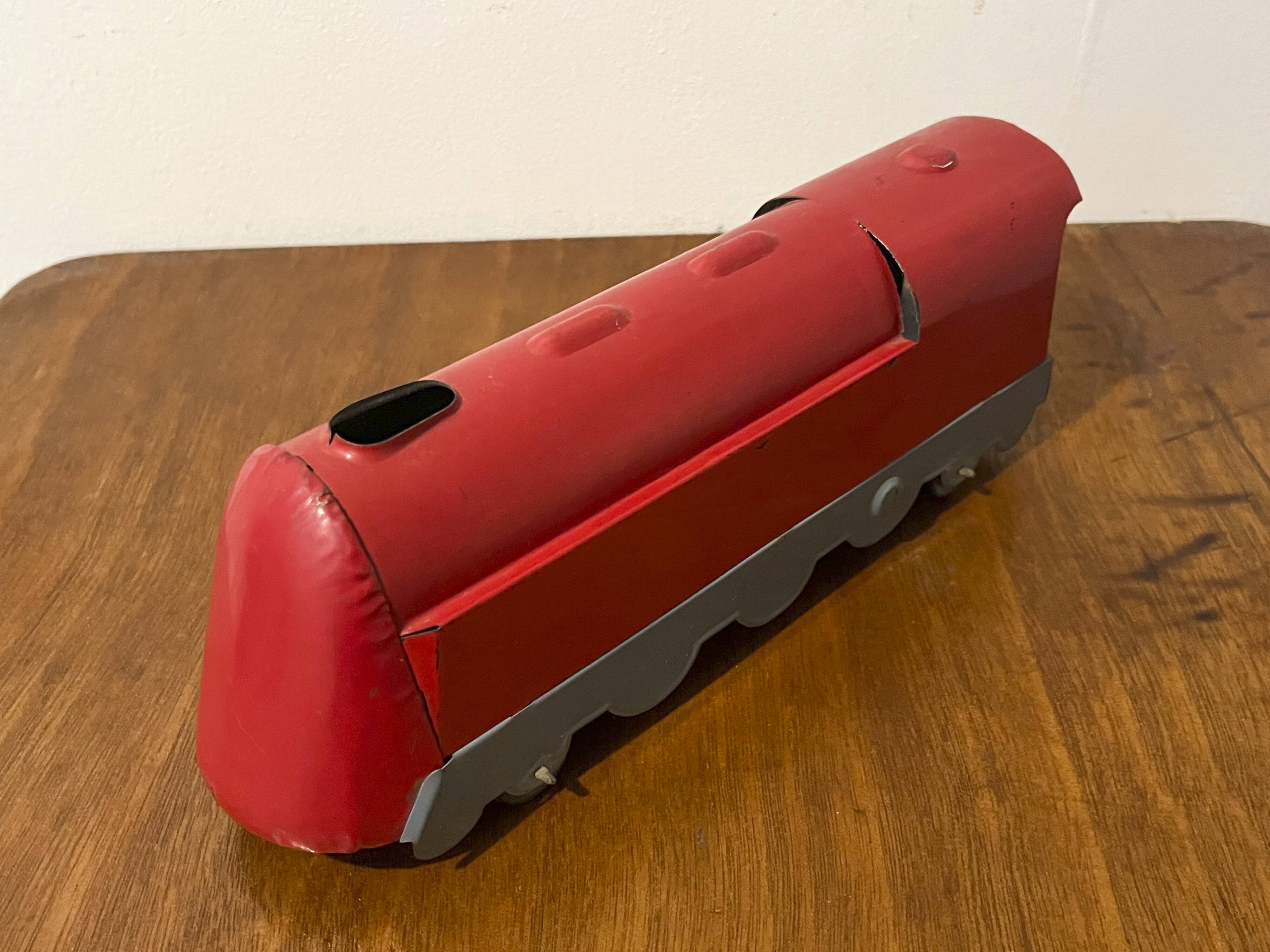 Red sheet metal locomotive 60s