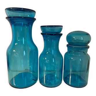 Set of three blue glass apothecary bottles