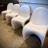 4 white Panton style armchairs