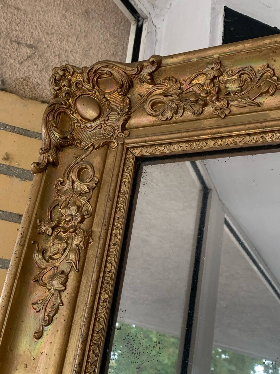 Old gilded mirror fireplace, 19th century restoration