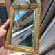 Small vintage mirror in gilded wood, bevelled glass with chain.