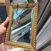 Small vintage mirror in gilded wood, bevelled glass with chain.