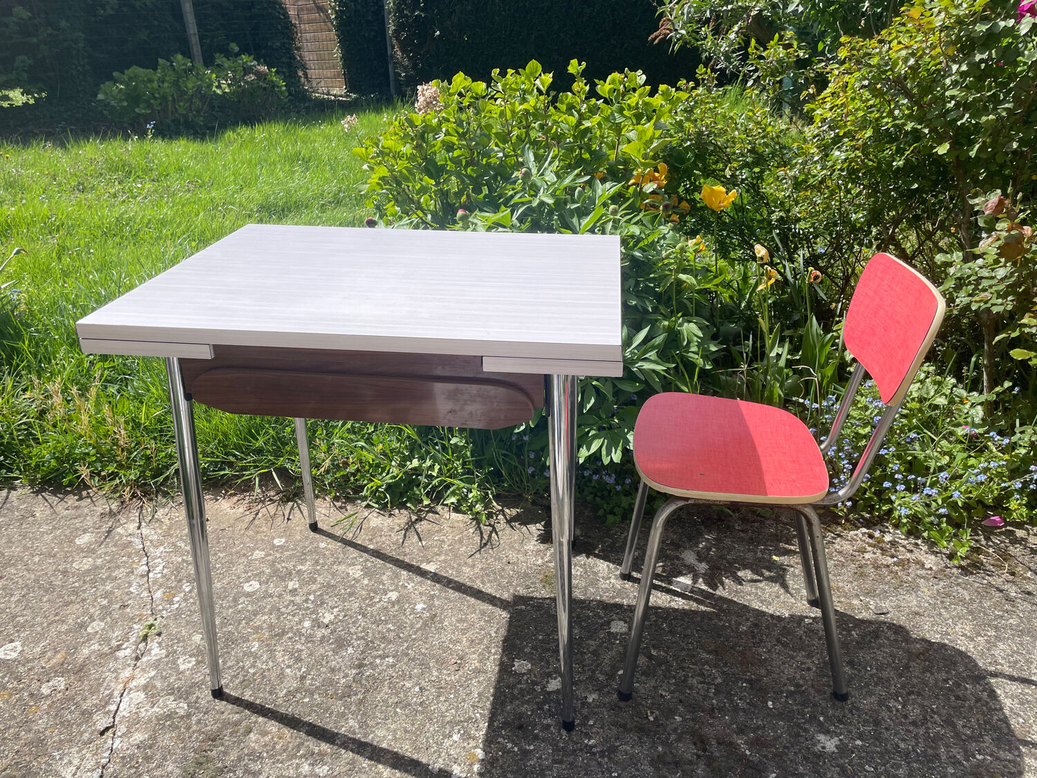 Formica table with a red Mid-century chair.
