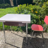 Formica table with a red Mid-century chair.