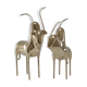 Two stylized zebu with long vintage brass horns