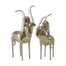 Two stylized zebu with long vintage brass horns