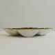 Shell-shaped porcelain pocket bowl from Queen’s Porcelain, with a gold rim.