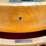 Half-moon commode in burl wood with a marble top.