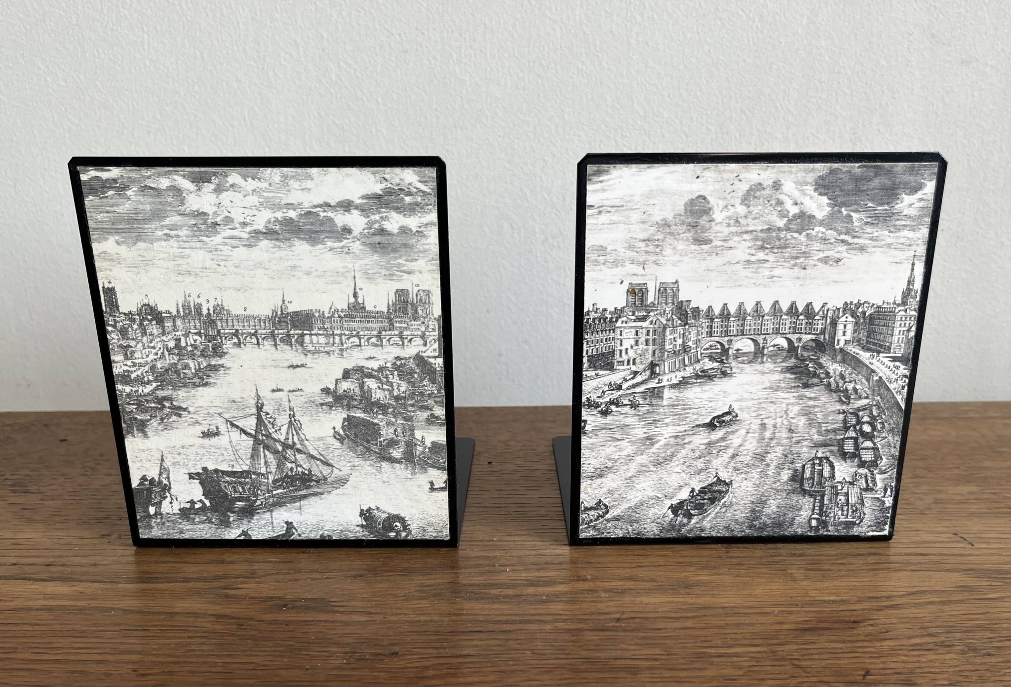 Bookends 1960 between Fornasetti's grey and Toile de Jouy views of Paris.