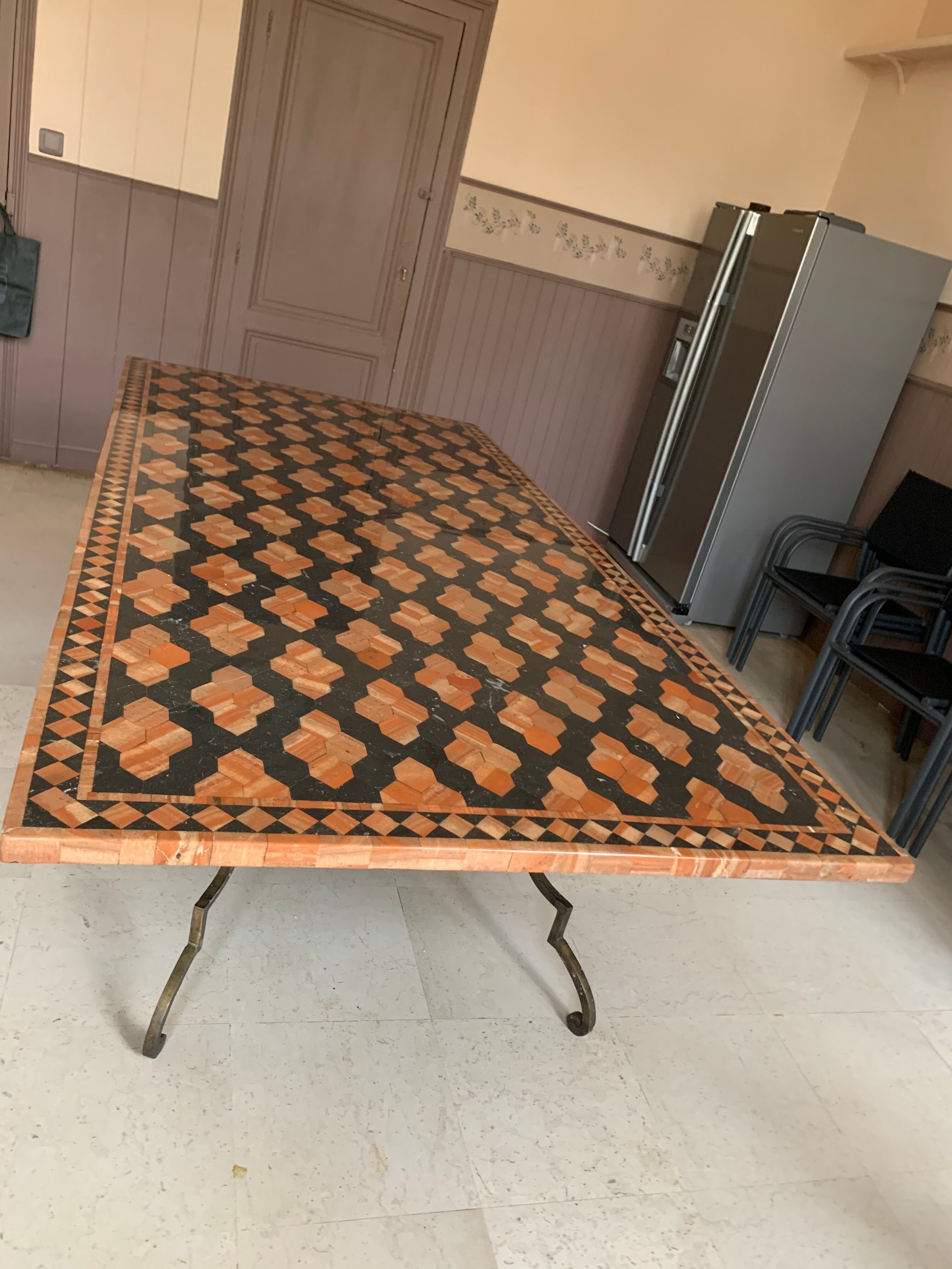 Wrought iron table on marble