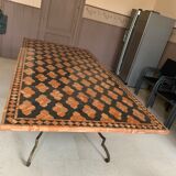 Wrought iron table on marble