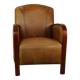 Luxurious cowhide Art Deco design armchair with wooden armrests and cognac-colored leather