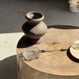 Petrified wood catchall or dish in beige with several grey spots in the centre.