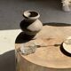Petrified wood catchall or dish in beige with several grey spots in the centre.