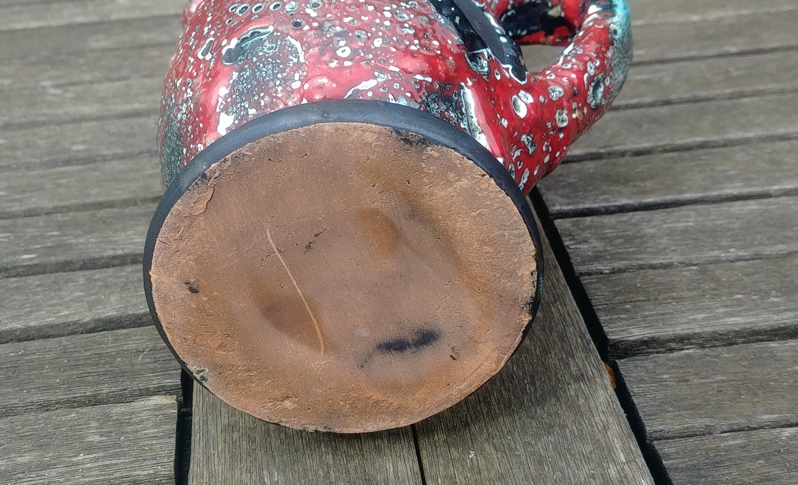 Glazed ceramic pitcher in Fat Lava style