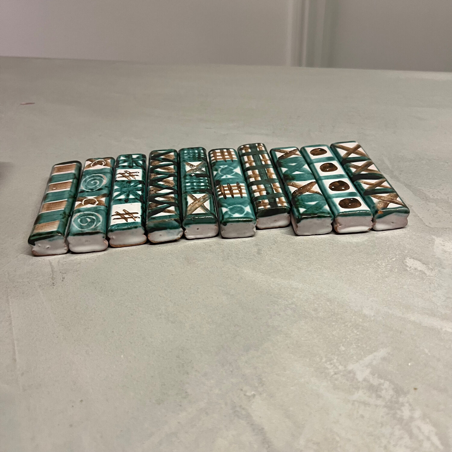 Set of 10 knife rests by Robert Picault