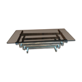 70s design coffee table in rectangular glass with chrome legs.