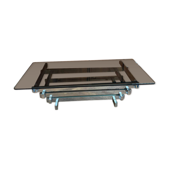 70s design coffee table in rectangular glass with chrome legs.