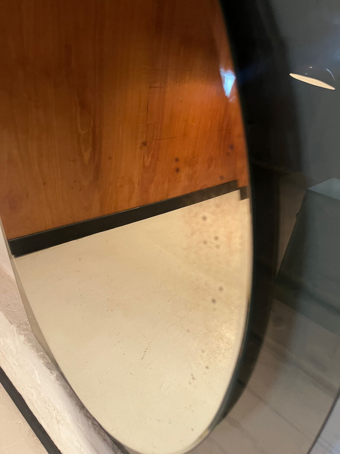 Vintage smoked glass mirror from around 1970.