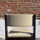 Many mid-century vintage wooden and fabric chairs.
