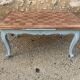 Louis XV style walnut table with a natural wood top.