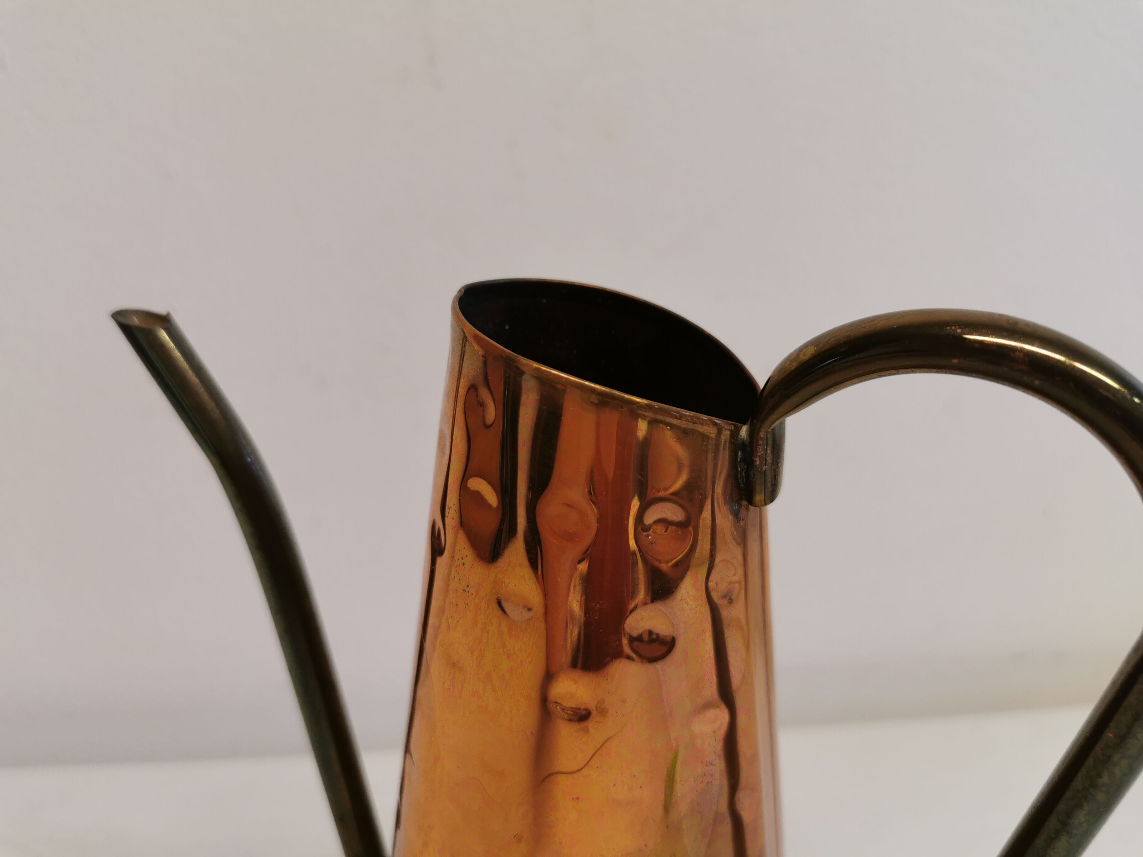Watering can from the 1950s, made of hammered copper and brass