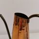Watering can from the 1950s, made of hammered copper and brass